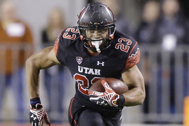Utah running back Devontae Booker (23) carries the ball in the second half of their NCAA college football game against Southern California Saturday, Oct. 25, 2014, in Salt Lake City. (AP Photo/Rick Bowmer)