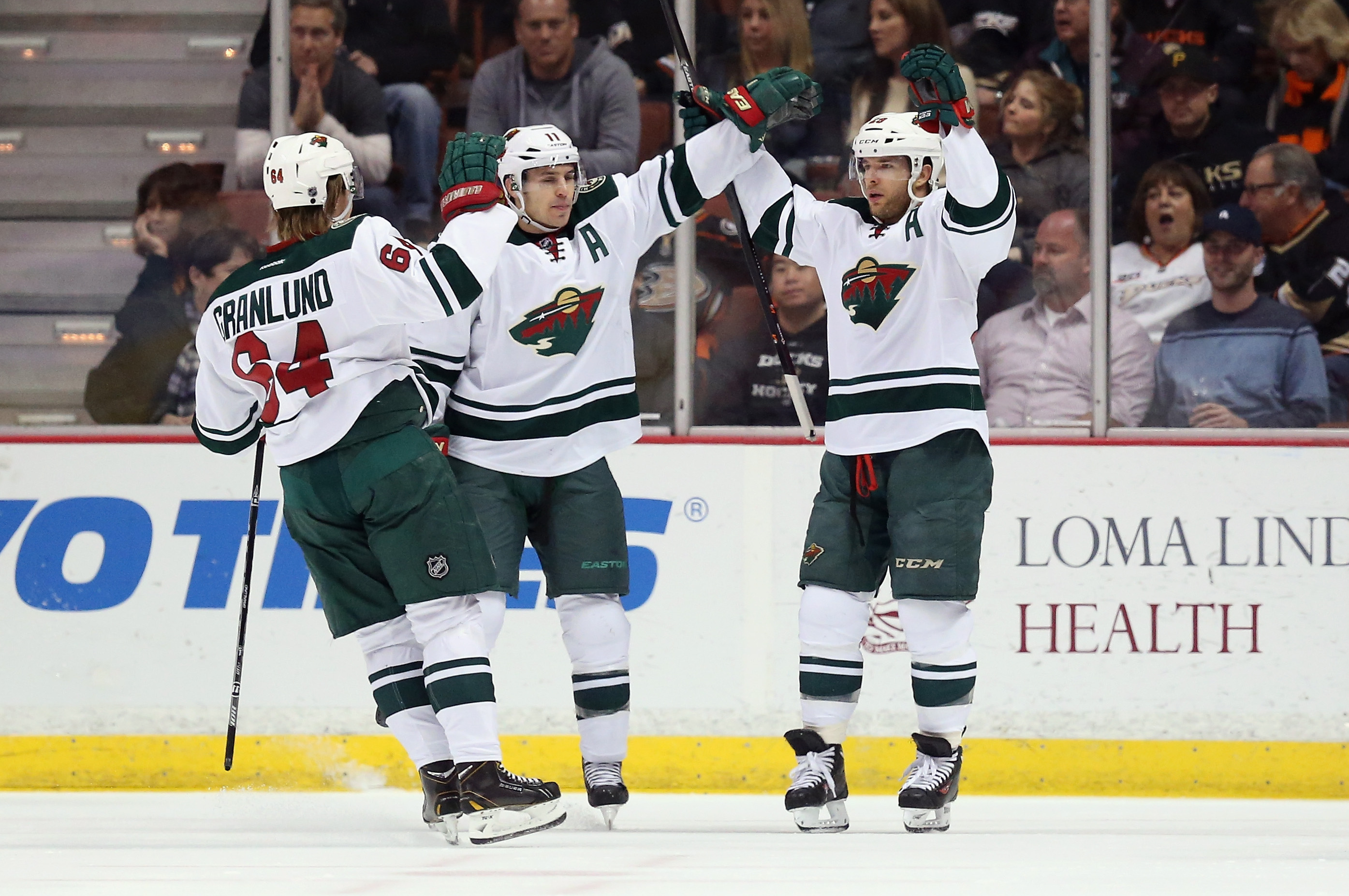 The Minnesota Wild's Mikael Granlund (64) takes a moment to greet