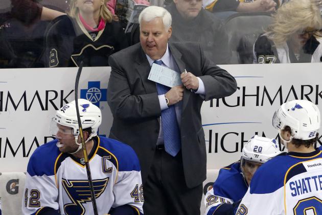 St. Louis Blues head coach Ken Hitchcock stands behind his bench during a timeout of an NHL hockey game against the Pittsburgh Penguins in Pittsburgh, Sunday, March 23, 2014. The Blues won 1-0. (AP Photo/Gene J. Puskar)
