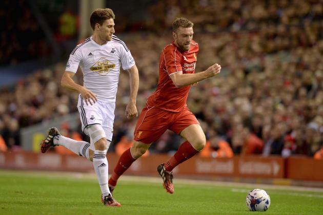 LIVERPOOL, ENGLAND - OCTOBER 28:  Rickie Lambert of Liverpool gets past Federico Fernandez of Swansea during the Capital One Cup Fourth Round match between Liverpool and Swansea City at Anfield on October 28, 2014 in Liverpool, England.  (Photo by Gareth Copley/Getty Images)