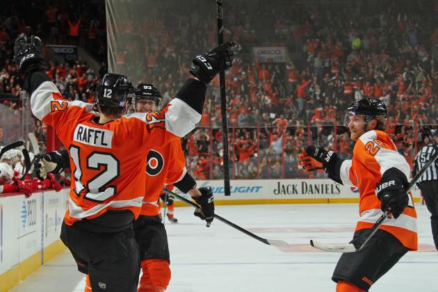 PHILADELPHIA, PA - OCTOBER 25: Michael Raffl #12 of the Philadelphia Flyers celebrates his third period goal against the Detroit Red Wings with Jakub Voracek #93 and Claude Giroux #28 on October 25, 2014 at the Wells Fargo Center in Philadelphia, Pennsylvania.  (Photo by Len Redkoles/NHLI via Getty Images)