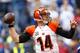 INDIANAPOLIS, IN - OCTOBER 19: Andy Dalton #14 of the Cincinnati Bengals drops bad to throw a pass during the second quarter against the Indianapolis Colts on October 19, 2014 at Lucas Oil Stadium on October 19, 2014 in Indianapolis, Indiana. (Photo by Kirk Irwin/Getty Images)