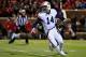 OXFORD, MS - NOVEMBER 01: Quarterback Nick Marshall #14 of the Auburn Tigers eludes Robert Nkemdiche #5 of the Mississippi Rebels and completes a first down pass in the third quarter at Vaught-Hemingway Stadium on November 1, 2014 in Oxford, Mississippi. Auburn defeated Mississippi 35-31. (Photo by Doug Pensinger/Getty Images)