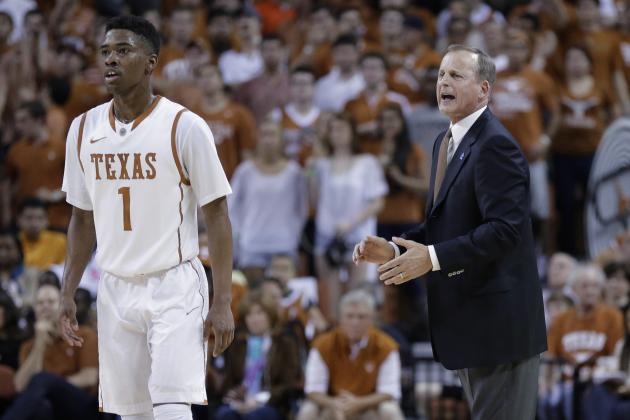 Texas coach Rick Barnes, right, talks with Isaiah Taylor during the first half of an NCAA college basketball game against Kansas, Saturday, Feb. 1, 2014, in Austin, Texas. (AP Photo/Eric Gay)