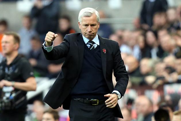 Newcastle United's manager Alan Pardew, left, celebrates his victory over Liverpool at the end of their English Premier League soccer match at St James' Park, Newcastle, England, Saturday, Nov. 1, 2014. (AP Photo/Scott Heppell)