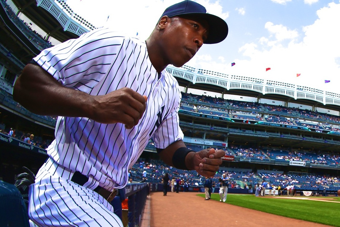New York Yankees' second baseman Alfonso Soriano evades Tigers