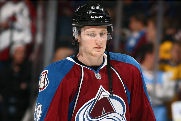 Nathan MacKinnon prepares before a game against the Boston Bruins at Pepsi Center on March 21, 2014 in Denver, Colorado.