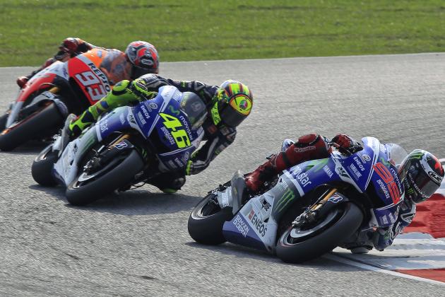 MotoGP rider Jorge Lorenzo, right, of Spain leads Valentino Rossi, center, of Italy, and Marc Marquez of Spain during the Malaysian Motorcycle Grand Prix in Sepang, Malaysia, Sunday, Oct. 26, 2014. (AP Photo/Lai Seng Sin)