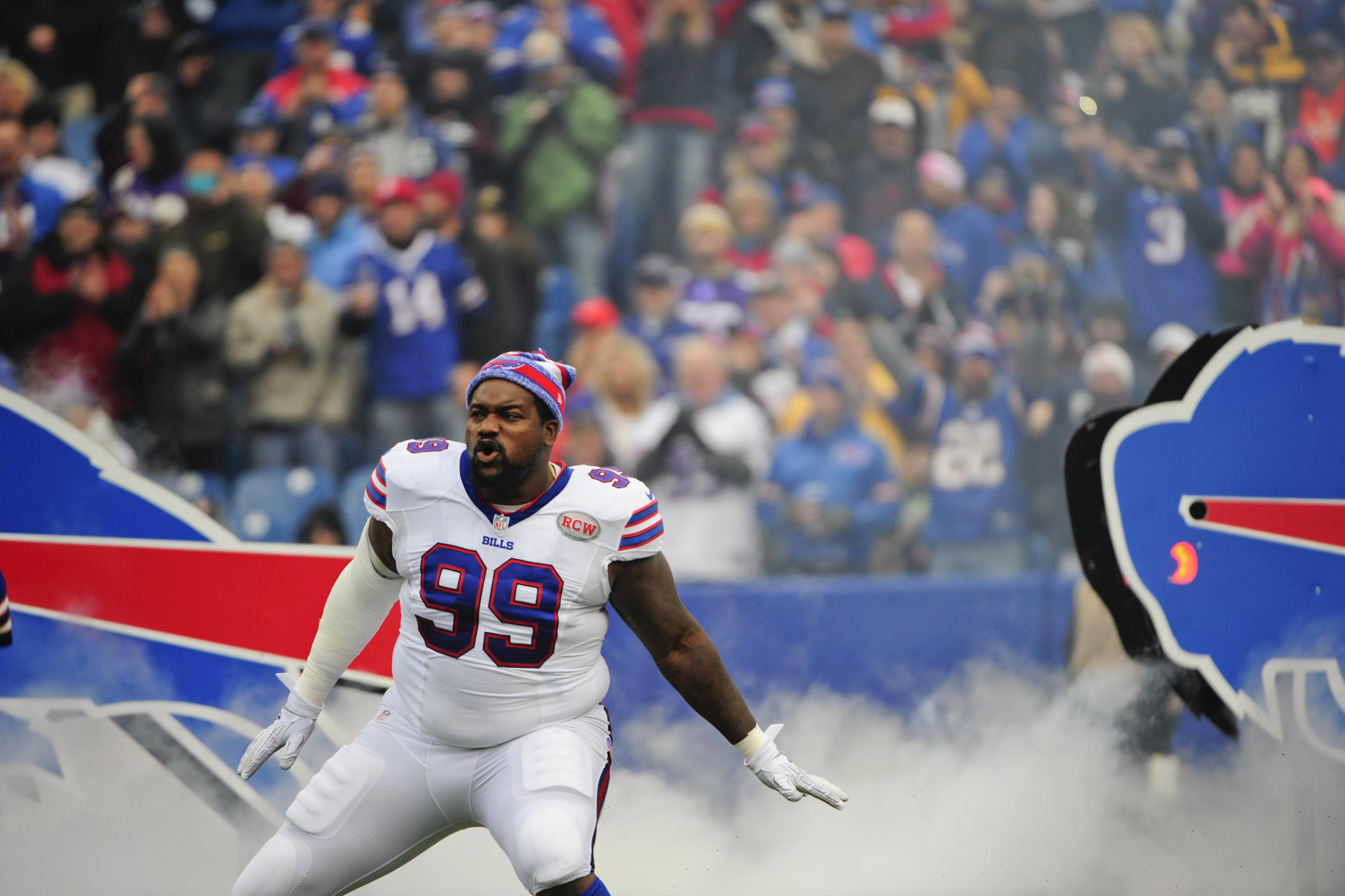 Buffalo Bills defensive tackle Marcell Dareus, center, passes