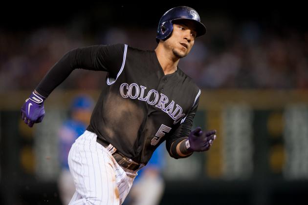 DENVER, CO - AUGUST 06:  Carlos Gonzalez #5 of the Colorado Rockies rounds third base to score a run in the seventh inning of a game against the Chicago Cubs at Coors Field on August 6, 2014 in Denver, Colorado.  (Photo by Dustin Bradford/Getty Images)