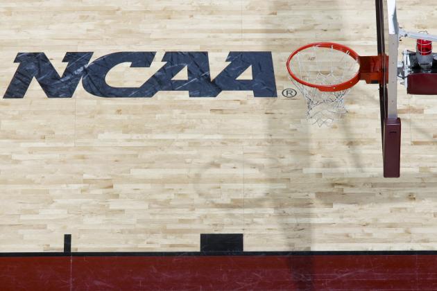 The NCAA floor logo and a basketball rim and net in the first half of an NCAA tournament second-round women's college basketball game between Marist and St. Bonaventure on Tuesday, March 20, 2012, in Tallahassee, Fla. St. Bonaventure beat Marist 66-63. (AP Photo/Phil Sears)