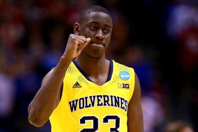 INDIANAPOLIS, IN - MARCH 28:  Caris LeVert #23 of the Michigan Wolverines celebrates defeating the Tennessee Volunteers 73 to 71 during the regional semifinal of the 2014 NCAA Men's Basketball Tournament at Lucas Oil Stadium on March 28, 2014 in Indianapolis, Indiana.  (Photo by Andy Lyons/Getty Images)