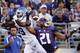 Washington's Marcus Peters (21) snags the ball in the end zone in front of intended receiver Georgia State's Robert Davis in the first half of an NCAA college football game Saturday, Sept. 20, 2014, in Seattle. Peters was flagged for pass interference on the play, leading to a Georgia State touchdown on the drive. (AP Photo/Elaine Thompson)