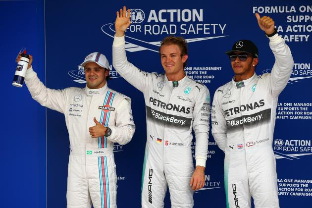 SAO PAULO, BRAZIL - NOVEMBER 08:  Nico Rosberg of Germany and Mercedes GP celebrates next to Lewis Hamilton of Great Britain and Mercedes GP and Felipe Massa of Brazil and Williams after claiming pole position during qualifying for the Brazilian Formula One Grand Prix at Autodromo Jose Carlos Pace on November 8, 2014 in Sao Paulo, Brazil.  (Photo by Mark Thompson/Getty Images)