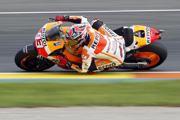 Moto GP rider Marc Marquez of Spain rides his motorbike during free practice at Spain's Valencia Motorcycle Grand Prix, the last race of the season, at the Ricardo Tormo circuit in Cheste near Valencia, Spain, Saturday Nov. 8, 2014. (AP Photo/Alberto Saiz)