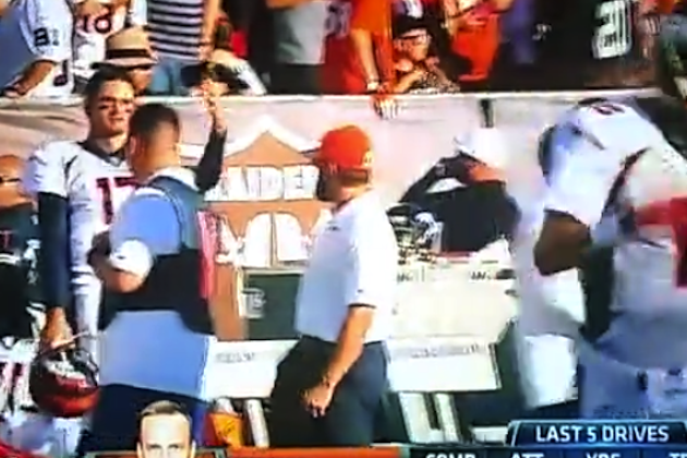 Brock Osweiler of the Denver Broncos warming up on the field before a