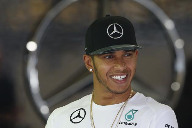 Mercedes driver Lewis Hamilton, of Britain, stands at his team's pit at the Interlagos race track in Sao Paulo, Brazil, Thursday, Nov. 6, 2014. The Formula One Brazilian Grand Prix will take place on Nov. 9. (AP Photo/Andre Penner)
