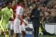 Barcelona's head coach Luis Enrique gives instructions to his players during the Group F Champions League match between AFC Ajax and FC Barcelona at ArenA stadium in Amsterdam, Netherlands, Wednesday, Nov. 5, 2014. (AP Photo/Peter Dejong)