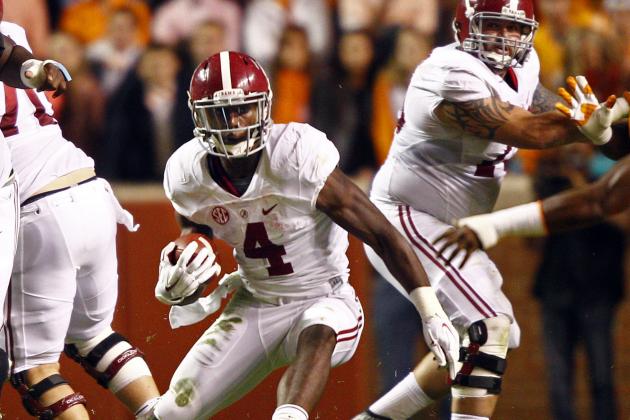 Alabama running back T.J. Yeldon (4) runs for yardage in the first quarter of an NCAA college football game against Tennessee, Saturday, Oct. 25, 2014 in Knoxville, Tenn. (AP Photo/Wade Payne)