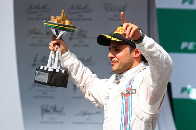 SAO PAULO, BRAZIL - NOVEMBER 09:  Felipe Massa of Brazil and Williams celebrates on the podium after finishing third in the Brazilian Formula One Grand Prix at Autodromo Jose Carlos Pace on November 9, 2014 in Sao Paulo, Brazil.  (Photo by Mark Thompson/Getty Images)