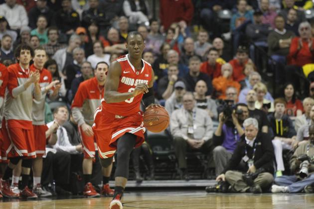 FILE - In this March 15, 2014, file photo, Ohio State's Shannon Scott brings the ball up during an NCAA college basketball game against Michigan in the semifinals of the Big Ten tournament in Indianapolis. Scott takes over at the point in place of departed senior Aaron Craft as the Buckeyes open the 2014-15 season. (AP Photo/Kiichiro Sato, File)