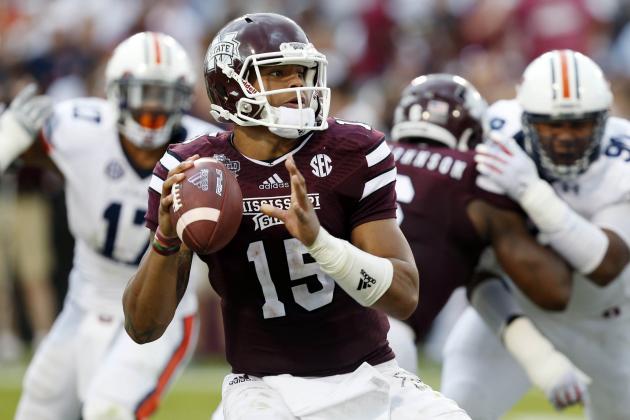 Mississippi State quarterback Dak Prescott (15) looks for an open man to pass to during the first half of an NCAA college football game against Auburn in Starkville, Miss., Saturday, Oct 11, 2014. No. 3 Mississippi State beat No. 2 Auburn, 38-23 (AP Photo/Rogelio V. Solis)