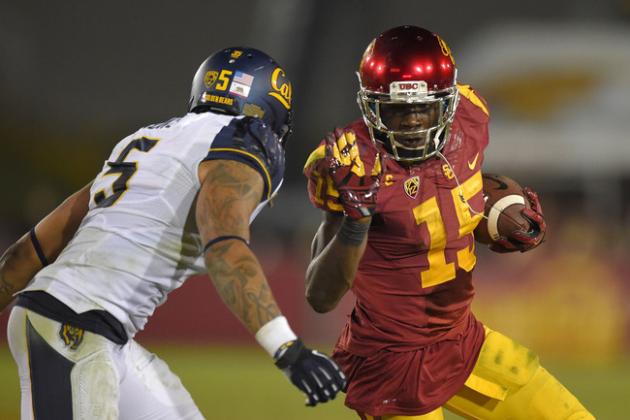 Southern California wide receiver Nelson Agholor, right, fends off California safety Michael Lowe during the first half of an NCAA college football game, Thursday, Nov. 13, 2014, in Los Angeles. (AP Photo/Mark J. Terrill)