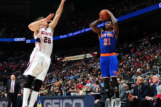ATLANTA, GA - NOVEMBER 8: Iman Shumpert #21 of the New York Knicks puts up a shot against the Atlanta Hawks on November 8, 2014 at Philips Arena in Atlanta, Georgia. NOTE TO USER: User expressly acknowledges and agrees that, by downloading and/or using this Photograph, user is consenting to the terms and conditions of the Getty Images License Agreement. Mandatory Copyright Notice: Copyright 2014 NBAE (Photo by Scott Cunningham/NBAE via Getty Images)