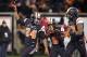 Oregon State tailback Storm Woods (24) celebrates with teammates Victor Bolden (6) and Jordan Villain (13), right, after scoring a touchdown against Arizona State during the first quarter of an NCAA college football game in Corvallis, Ore., Saturday, Nov. 15, 2014. (AP Photo/Troy Wayrynen)
