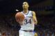 Nov 14, 2014; Lawrence, KS, USA; Kansas Jayhawks forward Perry Ellis (34) shoots a layup during the second half against the UC Santa Barbara Gauchos at Allen Fieldhouse. Kansas won 69 - 59. Mandatory Credit: Denny Medley-USA TODAY Sports