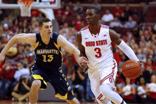 Ohio States' Shannon Scott (3) gets by Marquettes' Matt Carlino (13) in the second half of an NCAA basketball game, Saturday, Nov. 18, 2014, in Columbus, Ohio. Ohio State won 74-63. (AP Photo/Mike Munden)