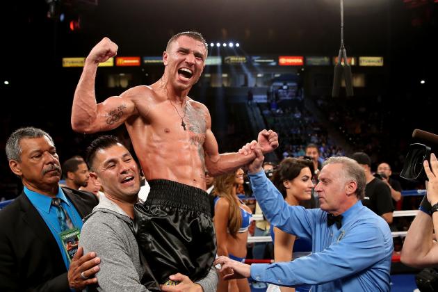 LOS ANGELES, CA - JUNE 21:  Vasyl Lomachenko celebrates after hearing the decision against Gary Russell Jr. in their WBO Featherwieight Title bout at StubHub Center on June 21, 2014 in Los Angeles, California.  Lomachenko won by split decision.  (Photo by Stephen Dunn/Getty Images)