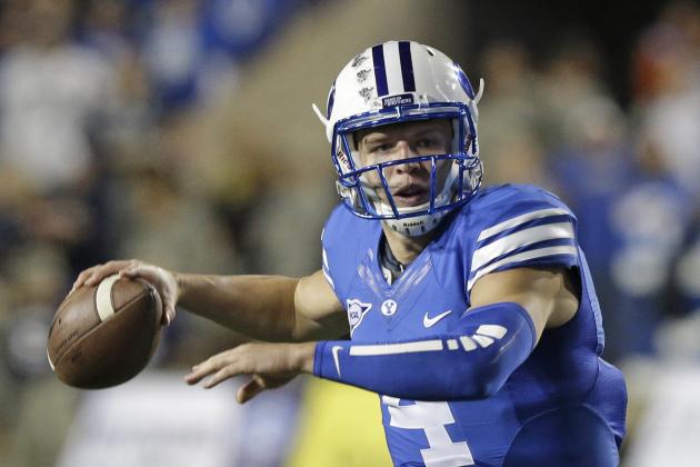 Brigham Young quarterback Taysom Hill (4) passes the ball in the first quarter during an NCAA college football game against Utah State Friday, Oct. 3, 2014, in Provo, Utah. (AP Photo/Rick Bowmer)