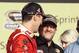 Kevin Harvick , left, talks to Tony Stewart as they celebrate winning the NASCAR Sprint Cup championship series auto race, Sunday, Nov. 16, 2014 in Homestead, Fla. (AP Photo/Darryl Graham)