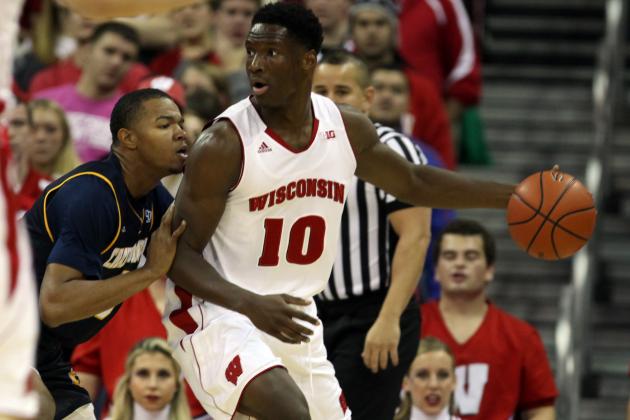 Nov 16, 2014; Madison, WI, USA; Wisconsin Badgers forward Nigel Hayes (10) attempts to move the ball past Chattanooga Mocs forward Chuck Ester (0) during the first half at the Kohl Center. Mandatory Credit: Mary Langenfeld-USA TODAY Sports