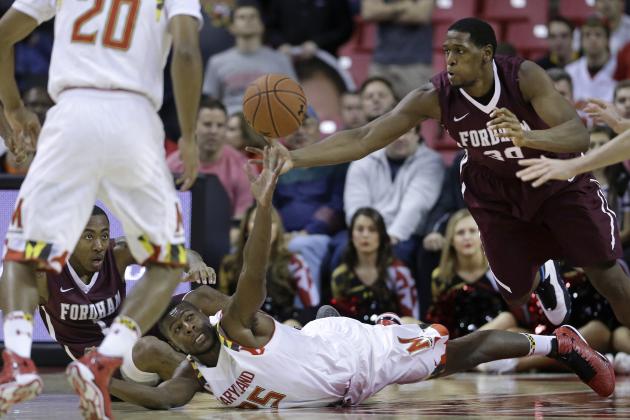 Maryland forward Jon Graham, bottom, and Fordham forward Ryan Rhoomes struggle for possession of the ball as Fordham guard Mandell Thomas, back left, and Maryland guard Richaud Pack (20) watch during the first half of an NCAA college basketball game, Thursday, Nov. 20, 2014, in College Park, Md. (AP Photo/Patrick Semansky)