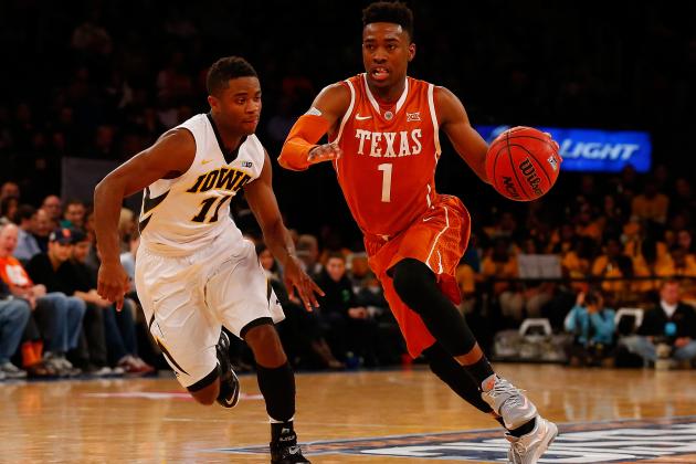 NEW YORK, NY - NOVEMBER 20:  Isaiah Taylor #1 of the Texas Longhorns drives to the net against Trey Dickerson #11 of the Iowa Hawkeyes during the 2K Classic at Madison Square Garden on November 20, 2014 in New York City.  (Photo by Mike Stobe/Getty Images)