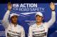 ABU DHABI, UNITED ARAB EMIRATES - NOVEMBER 22: Nico Rosberg of Germany and Mercedes GP waves to the crowd next to Lewis Hamilton of Great Britain and Mercedes GP after claiming pole position during qualifying for the Abu Dhabi Formula One Grand Prix at Yas Marina Circuit on November 22, 2014 in Abu Dhabi, United Arab Emirates. (Photo by Mark Thompson/Getty Images)