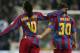 MADRID, SPAIN - NOVEMBER 19: Ronaldinho (L) of Barcelona celebrates with Lionel Messi after scoring a goal during the Primera Liga match between Real Madrid and F.C. Barcelona at the Bernabeu on November 19, 2005 in Madrid, Spain. (Photo by Denis Doyle/Getty Images)