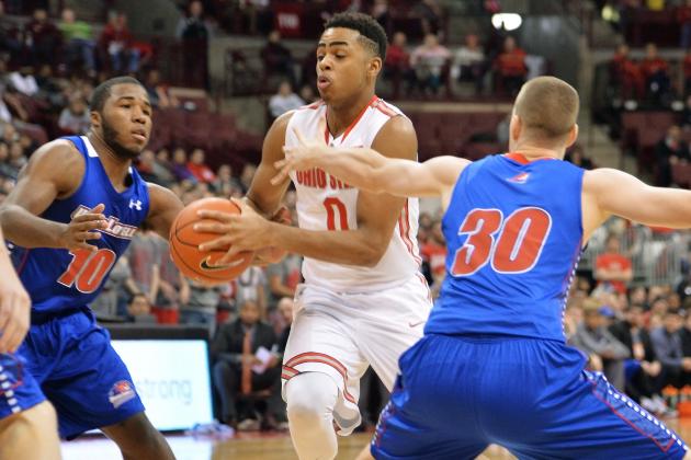 COLUMBUS, OH - NOVEMBER 14:  D'Angelo Russell #0 of the Ohio State Buckeyes drives the lane between Jahad Thomas #10 of the Massachusetts-Lowell River Hawks and Mark Cornelius  #30 of the Massachusetts-Lowell River Hawks in the second half on November 14, 2014 at Value City Arena in Columbus, Ohio. Ohio State defeated Massachusetts-Lowel 92-55.  (Photo by Jamie Sabau/Getty Images)