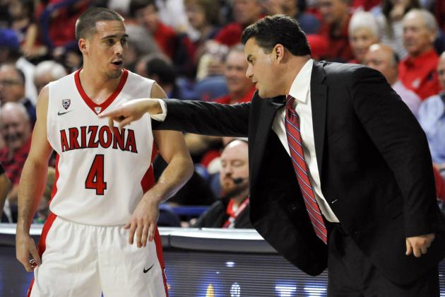 Nov 14, 2014; Tucson, AZ, USA; Arizona Wildcats guard T.J. McConnell (4) and Arizona Wildcats head coach Sean Miller talk during the second half against the Mount St. Mary's Mountaineers at McKale Center. Arizona won 78-55. Mandatory Credit: Casey Sapio-USA TODAY Sports