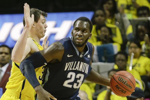Michigan's Ricky Doyle, left, defends Villanova's Daniel Ochefu (23) during the first half of an NCAA college basketball game Tuesday, Nov. 25, 2014, in New York. (AP Photo/Frank Franklin II)