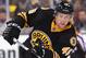 BOSTON, MA - NOVEMBER 15 : Joe Morrow #45 of the Boston Bruins passes the puck against the Carolina Hurricanes at the TD Garden on November 15, 2014 in Boston, Massachusetts. (Photo by Brian Babineau/NHLI via Getty Images)