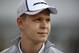 NORTHAMPTON, ENGLAND - JULY 03: Kevin Magnussen of Denmark and McLaren looks on during a TV broadcast ahead of the British Formula One Grand Prix at Silverstone Circuit on July 3, 2014 in Northampton, United Kingdom. (Photo by Drew Gibson/Getty Images)