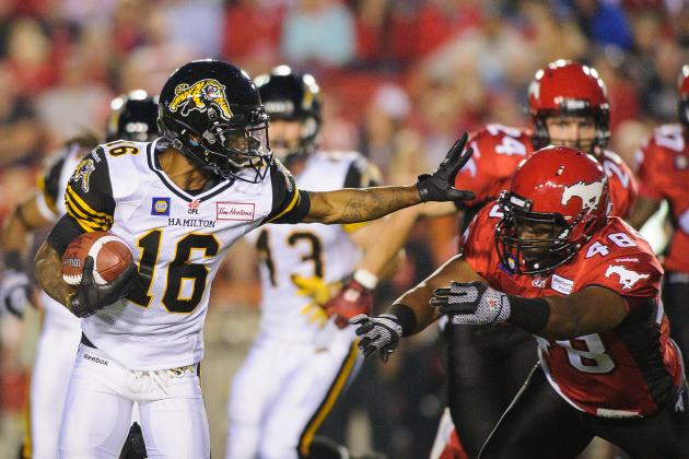 CALGARY, AB - JULY 18: Yannick Carter #48 of the Calgary Stampeders chases Brandon Banks #16 of the Hamilton Tiger-Cats during a CFL game at McMahon Stadium on July 18, 2014 in Calgary, Alberta, Canada. The Stampeders defeated the Tiger-Cats 10-7.  (Photo by Derek Leung/Getty Images)