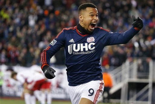 New England Revolution's Charlie Davies (9) celebrates his goal against the New York Red Bulls during the second half of the second soccer game of the MLS Eastern Conference final in Foxborough, Mass., Saturday, Nov. 29, 2014. The match ended 2-2 and New England advanced to the MLS Cup with a two-game aggregate 4-3. (AP Photo/Elise Amendola)