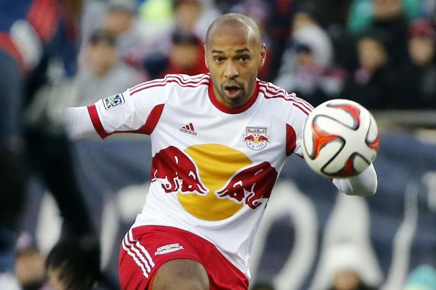 New York Red Bulls forward Thierry Henry handles the ball against the New England Revolution during the first half of the second soccer game of the MLS Eastern Conference final in Foxborough, Mass., Saturday, Nov. 29, 2014. The match ended 2-2 and New England advances with a two-game aggregate 4-3. (AP Photo/Elise Amendola)