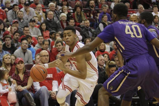 Ohio State's D'Angelo Russell, left, drives to the basket against James Madison's Yohanny Dalembert during the first half of an NCAA college basketball game Friday, Nov. 28, 2014, in Columbus, Ohio. Ohio State beat James Madison 73-56. (AP Photo/Jay LaPrete)