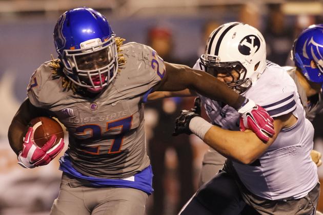 Boise State running back Jay Ajayi (27) runs the ball past BYU linebacker Zac Stout during the second half of an NCAA college football game in Boise, Idaho, on Friday, Oct. 24, 2014. Boise State won 55-30. (AP Photo/Otto Kitsinger)