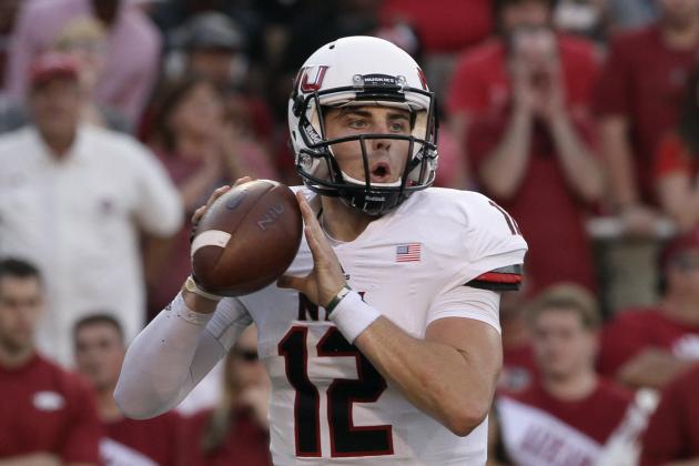Northern Illinois quarterback Drew Hare passes in the first quarter of an NCAA college football game in Fayetteville, Ark., Saturday, Sept. 20, 2014. (AP Photo/Danny Johnston)